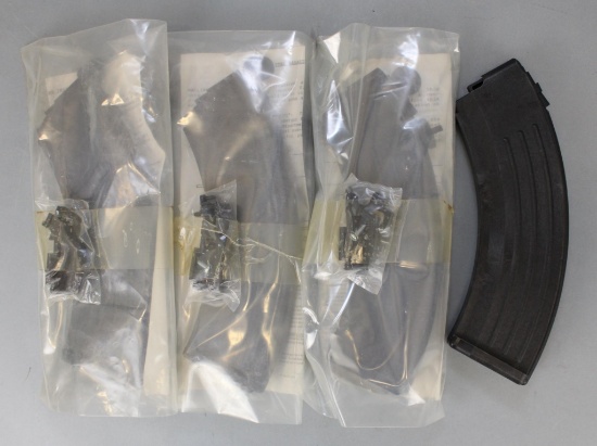 Lot of 4 - 30 round detachable SKS magazines.