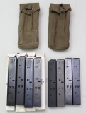8 Uzi 32 round magazines and 2 canvas double mag pouches.