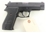 Sig Sauer P220 semi-automatic pistol.