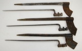 Grouping of 3 US marked socket bayonets with leather scabbards.