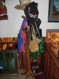 Oak coat rack with purses and hats