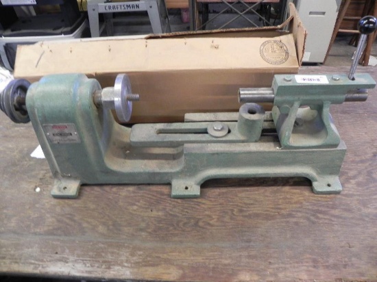 Spin-Shop 12" metal spinning lathe with box of metal spinning chucks.