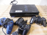PlayStation 2 with 3 remotes and memory card.
