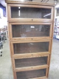 Oak glass doored book case with brass hardware
