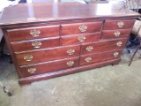 7 drawer American Drew cherry wood dresser with brass hardware.