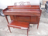 Gulbransen cherry wood upright piano with bench.