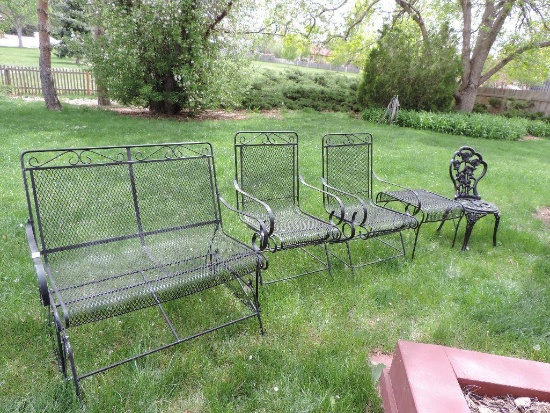 Black metal bench, 2 chairs, foot stool,cast iron chair and glass top patio table. (6 pieces)