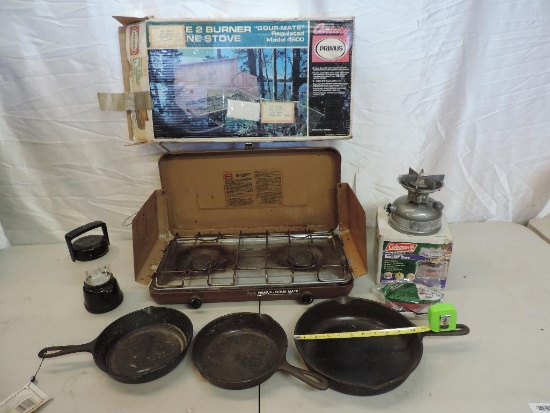 Camping gear lot. Coleman Dual fuel 533 stove,Century primus camp stove and 3 cast iron skillets.