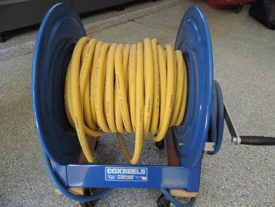 Cox model 1125-4-200-BEXX air hose reel in excellent condition with hose and wheels.