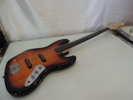 Fender Squire Jazz Bass Sunburst electric guitar.