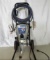 Graco Magnum XR7 paint sprayer with hose and spray gun.