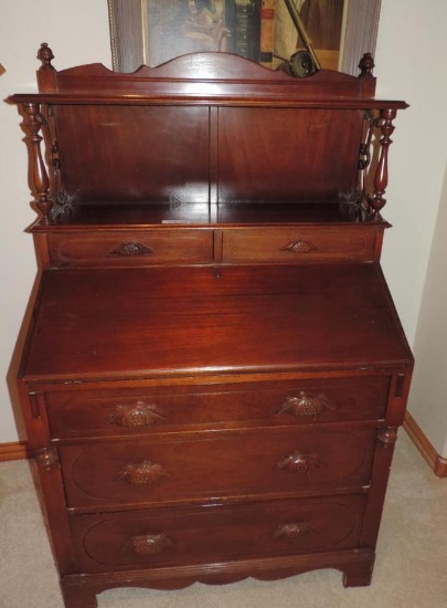 1940's cherry wood drop front desk with key in excellent condition. 35x21x52".