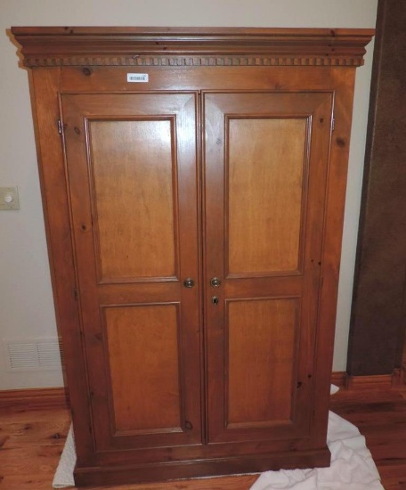 42x22x69" armoir with 2 shelves.