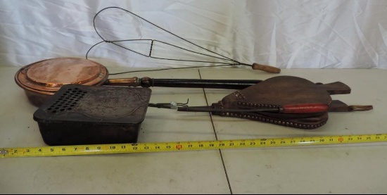 Antique copper bed warmer, rug beater, bellows and more.