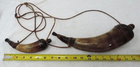 2 horn flintlock powder horns.