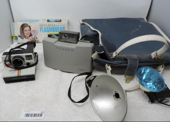 Polaroid land cameras and flash bulbs lot.