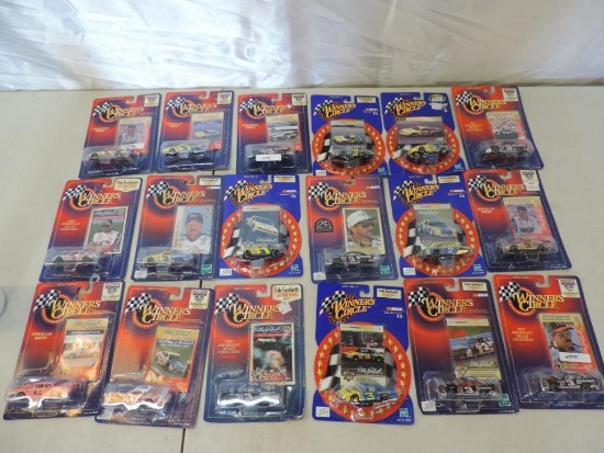 18 Winner's circle Dale Earnhardt 1/64 scale die cast cars in new condition.
