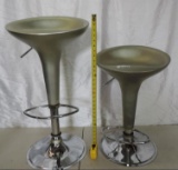 Pair of modern style adjustable height swivel bar stools.