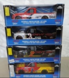 4 racing champions 1/24 scale die cast trucks.