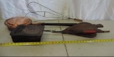 Antique copper bed warmer, rug beater, bellows and more.