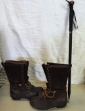 Lacrosse Big mountain size 11 boots and a Tracks walking stick.