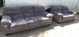 Nice grey upholstered couch and loveseat set.