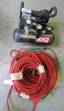 Senco model 1010 1 gallon air compressor with air hose and extension cords.