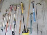 Huge lot of yard tools, sledge hammer, post hole digger, shovels and much more.