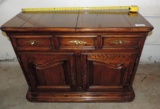 Oak server with fold out bar top.