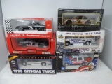 6 1/24th scale diecast cars.