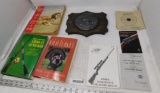 Gun books and plaque