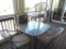 Glass top patio table with 4 chairs.