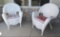 Pair of hampton bay white plastic wicker chairs.