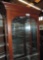 Display cabinet with glass shelves.