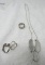 Silver cat necklace and 3 silver rings.