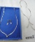 2 silver necklaces and earrings.