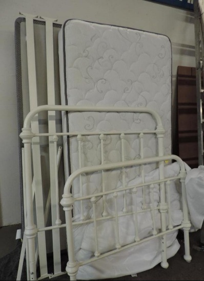 White twin metal bed with Serta pillow top mattress.