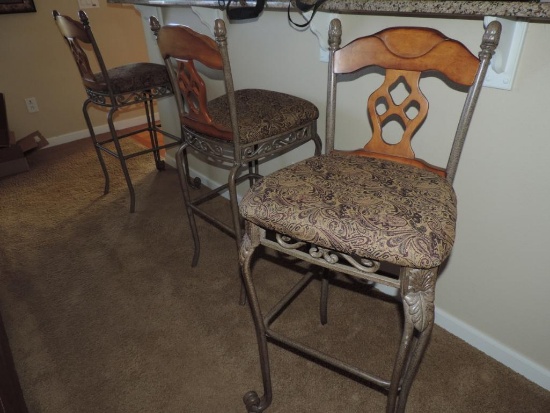 3 cast metal bar stools.
