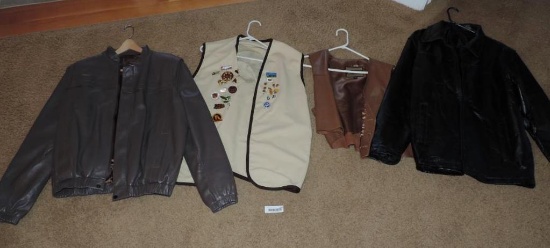 2 leather jackets, 1 leather vest and vest with pins.