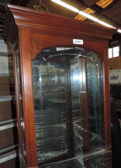 Display cabinet with glass shelves.