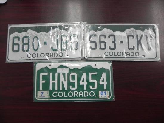 Three sets of Colorado License Plates.