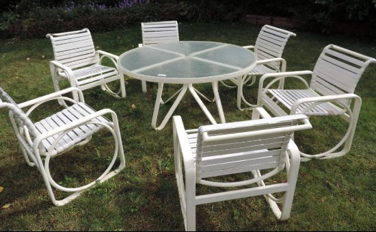 Glass top patio table with 6 chairs.