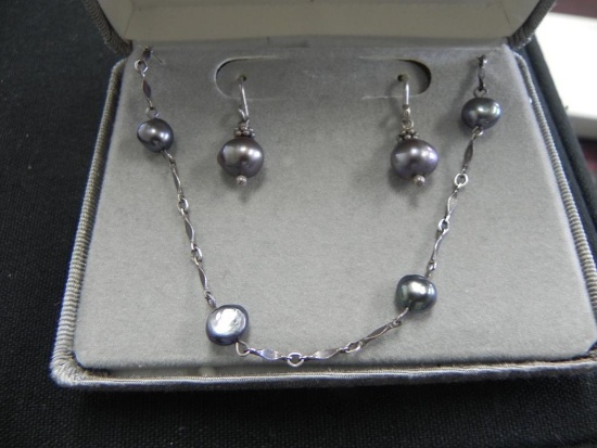Freshwater pearl and silver earring and pendant set.