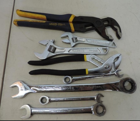 2 pair of pliers, 2 adjustable wrenches and 4 gear wrench's.