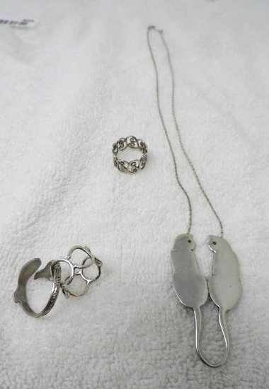 Silver cat necklace and 3 silver rings.