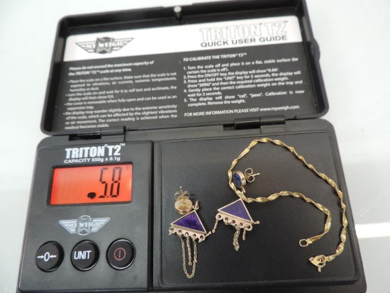Marked 14 k bracelet and earrings, 5.8gr total weight with stones.