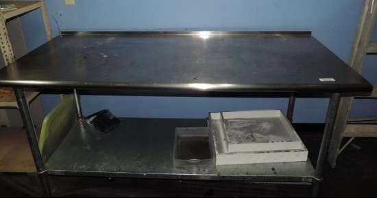 6'x30"x3' stainless steel table.