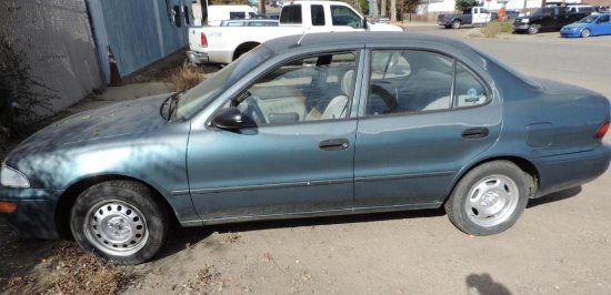 1995 Geo Prizm sedan with 69K miles.