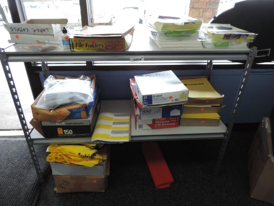 4'x18"x3' shelf with office supplies.