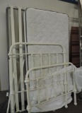 White twin metal bed with Serta pillow top mattress.